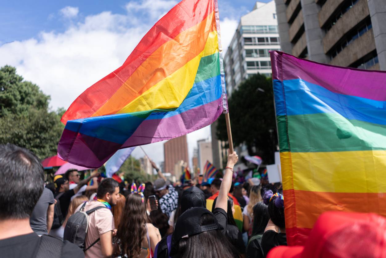 Diverse people attending a LGBTQIA parade during pride month
